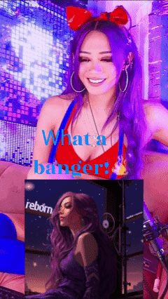 A Woman With Purple Hair And A Red Top With The Words What A Banger GIF
