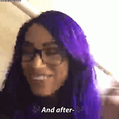 a woman with purple hair and glasses is smiling and talking .