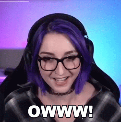 A Woman With Purple Hair And Glasses Says Owww GIF