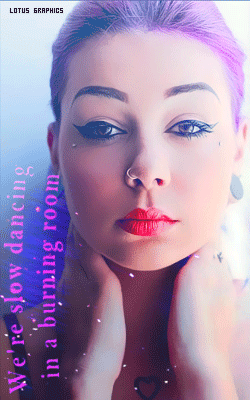 A Woman With Purple Hair Has A Tattoo Of A Heart On Her Chest GIF