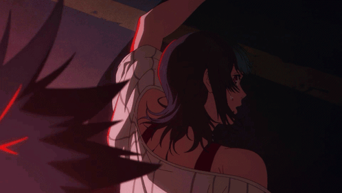 A Woman With Purple Hair Is Being Held By A Man GIF