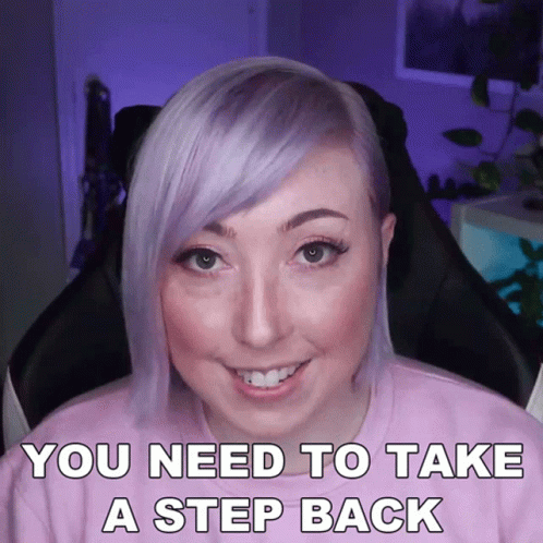 A Woman With Purple Hair Is Sitting In A Chair With The Words You Need To Take A Step Back GIF