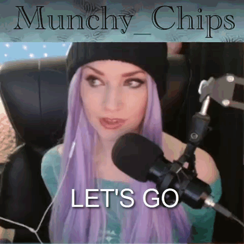 A Woman With Purple Hair Is Sitting In Front Of A Microphone With The Words " Let 'S Go " Above Her GIF