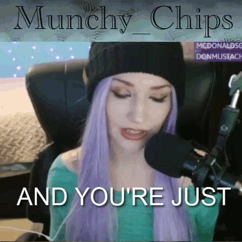 A Woman With Purple Hair Is Sitting In Front Of A Microphone With The Words " Munchies And You 'Re Just " GIF