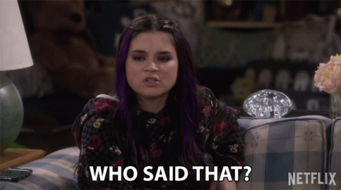 A Woman With Purple Hair Is Sitting On A Couch And Saying Who Said That GIF