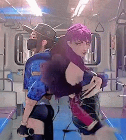 A Woman With Purple Hair Is Standing Next To Another Woman In A Mask GIF