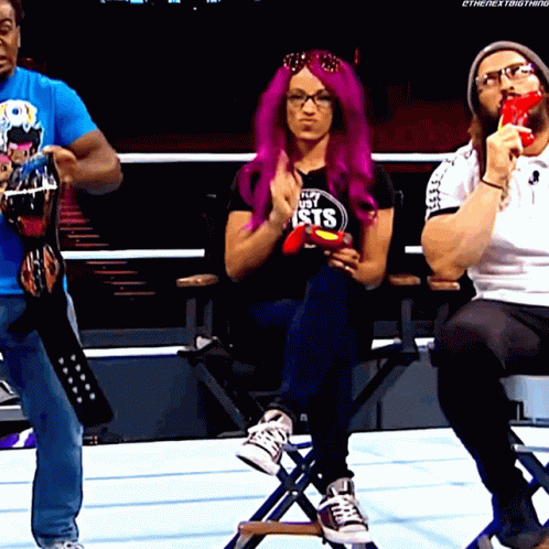 A Woman With Purple Hair Is Wearing A Shirt That Says ' My Sisters ' On It GIF