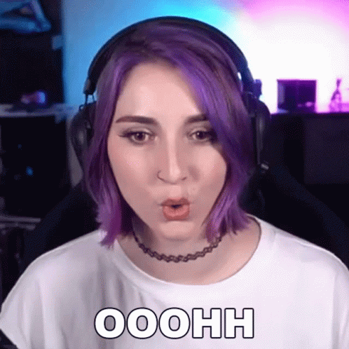 A Woman With Purple Hair Is Wearing Headphones And A Choker And Says Ooohh GIF