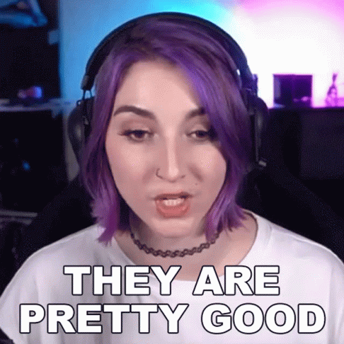 A Woman With Purple Hair Is Wearing Headphones And Saying They Are Pretty Good GIF
