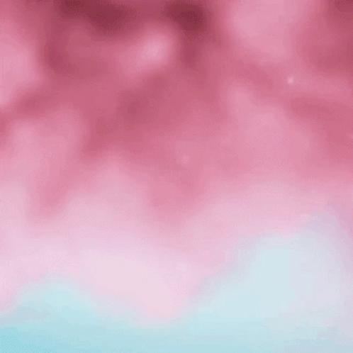A Woman With Purple Hair Is Wearing Pink Hoop Earrings And A Pink Braided Ponytail . GIF