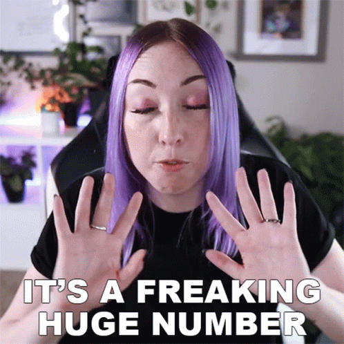 A Woman With Purple Hair Says It 'S A Freaking Huge Number With Her Hands GIF