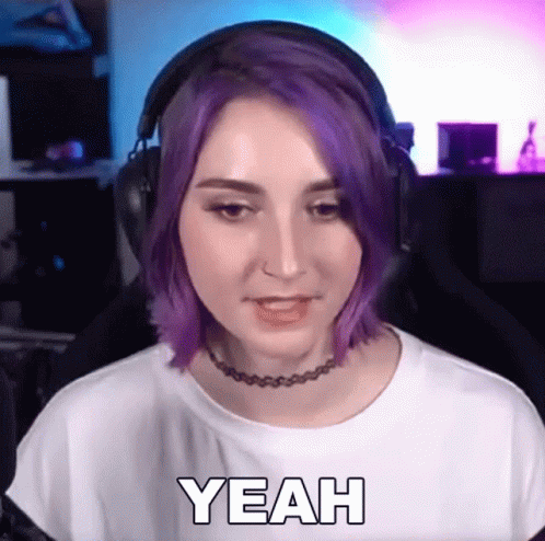 A Woman With Purple Hair Wearing Headphones And A Choker Says Yeah GIF