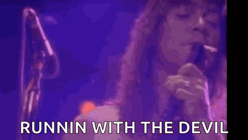 A Woman With Purple Smoke Coming Out Of Her Mouth With The Words Runnin With The Devil Written Below Her GIF
