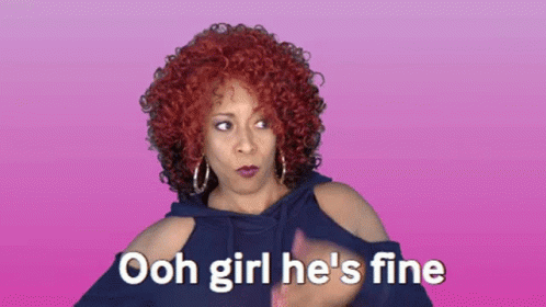 A Woman With Red Curly Hair Says " Ooh Girl He 'S Fine " GIF