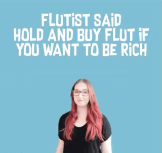 A Woman With Red Hair And Glasses Says Flutist Said Hold And Buy Flut If You Want To Be Rich .. GIF