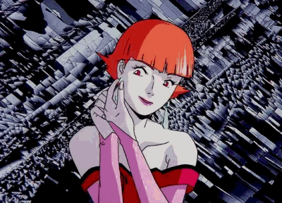 A Woman With Red Hair And Pink Gloves Stands In Front Of A Geometric Background GIF