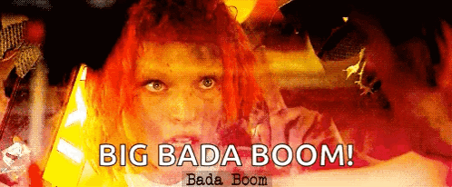 A Woman With Red Hair And The Words Big Bada Boom On The Bottom GIF