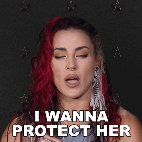 A Woman With Red Hair Blowing A Kiss With The Words I Wanna Protect Her Behind Her GIF