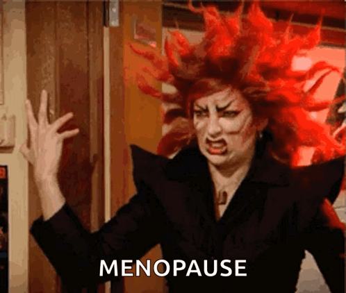 A Woman With Red Hair Has The Word Menopause Written On The Bottom GIF