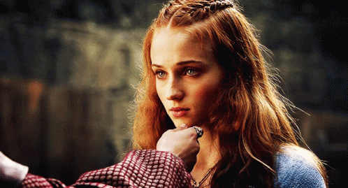 A Woman With Red Hair Is Being Touched By A Man With A Ring On Her Finger GIF