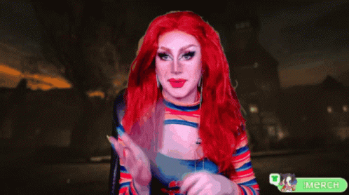 A Woman With Red Hair Is Holding A Knife In Front Of A Green Merch Button GIF