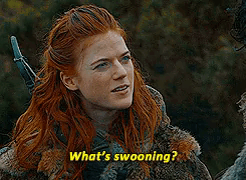A Woman With Red Hair Is Holding A Sword And Saying What 'S Swooning ? GIF