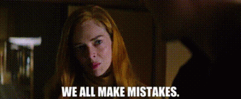 A Woman With Red Hair Is Looking At The Camera With The Words `` We All Make Mistakes '' Written Below Her . GIF