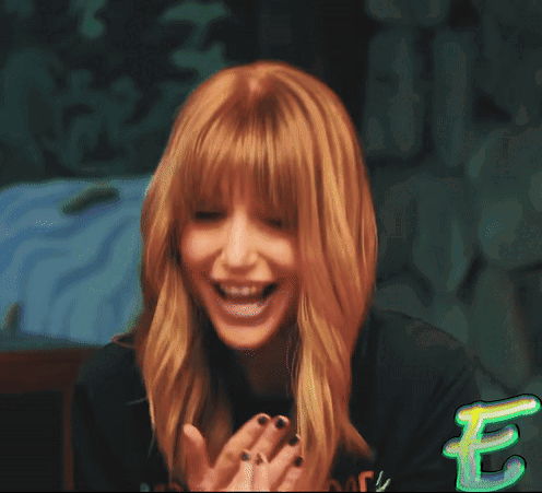 A Woman With Red Hair Is Making A Funny Face With The Word Ex Written In Green GIF