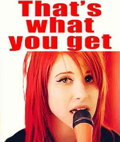 A Woman With Red Hair Is Singing Into A Microphone With The Words That 'S What You Get Behind Her GIF
