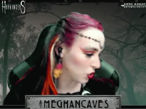 A Woman With Red Hair Is Sitting In A Chair With A Sign That Says Meghancaves On It . GIF