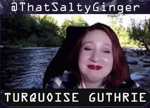 A Woman With Red Hair Is Smiling In Front Of A River And The Words That Salty Ginger Turquoise Guthrie GIF