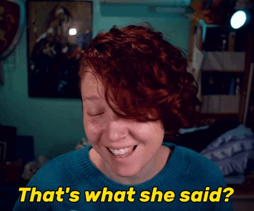 a woman with red hair is smiling with the words that 's what she said below her