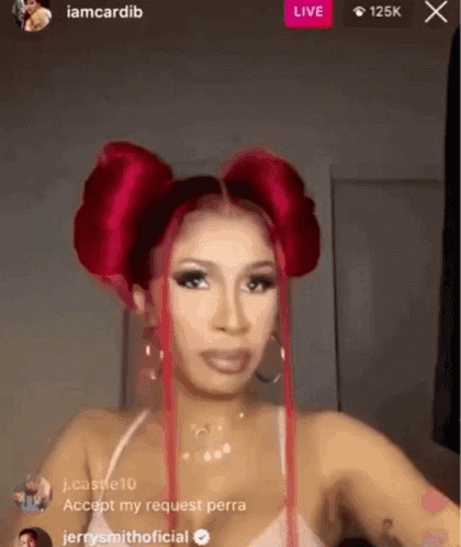 A Woman With Red Hair Is Standing In Front Of A Live Stream . GIF