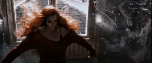 A Woman With Red Hair Is Standing In Front Of A Window With A Sign That Says All Powers GIF