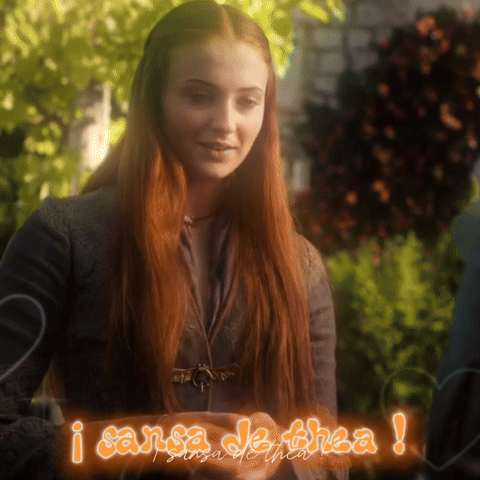 A Woman With Red Hair Is Standing Next To A Sign That Says I Sansa De Thea GIF