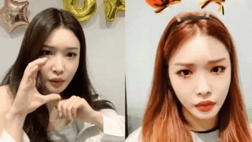 A Woman With Red Hair Is Wearing A Headband That Has The Letter O On It GIF
