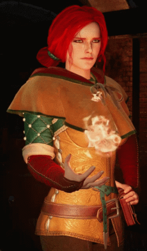A Woman With Red Hair Is Wearing A Hooded Cape GIF