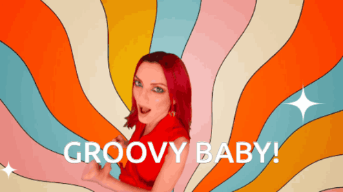 A Woman With Red Hair Says Groovy Baby In Front Of A Psychedelic Background GIF