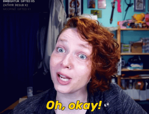 A Woman With Red Hair Says Oh Okay In Yellow GIF