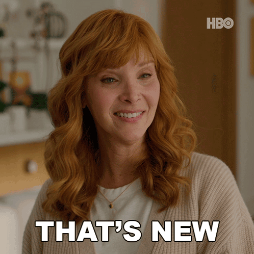 A Woman With Red Hair Says That 'S New In Front Of A Hbo Logo GIF