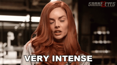 A Woman With Red Hair Says Very Intense In A Snake Eyes Ad GIF