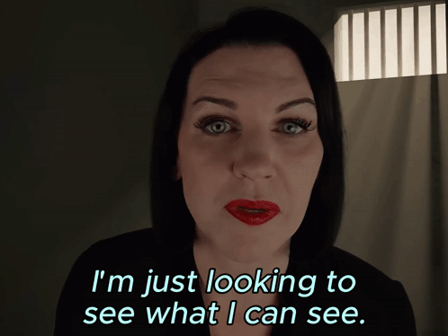 A Woman With Red Lips Is Looking To See What I Can See GIF