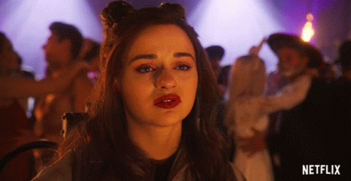 A Woman With Red Lips Is Standing In Front Of A Purple Background With The Word Netflix On It GIF