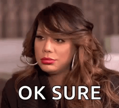 A Woman With Red Lipstick And Hoop Earrings Is Making A Funny Face And Saying Ok Sure . GIF