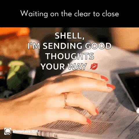 a woman with red nails is reading a newspaper with a kiss on her finger