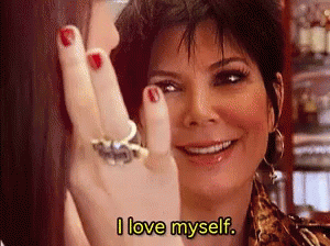 A Woman With Red Nails Is Smiling And Says I Love Myself . GIF