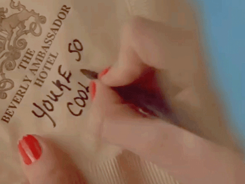A Woman With Red Nails Writes " You 'Re So Cool " GIF