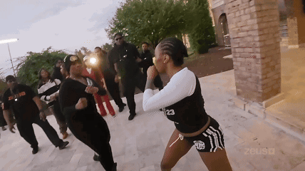 A Woman With The Number 23 On Her Top GIF