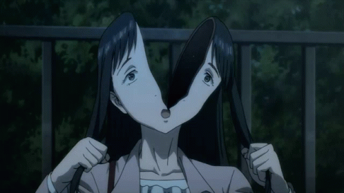 A Woman With Two Faces Is Holding A Stick In Her Mouth GIF