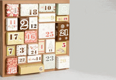 A Wooden Advent Calendar With Boxes Labeled With The Numbers 1 Through 20 GIF